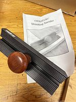Black shooting sander and instruction manual