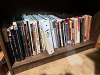 Shelf containing about 30 woodworking and tool books