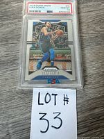 Full view of encapsulated Luka Doncic PSA card with lot number slip