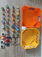 Entire lot showing 30 tops, 2 arenas, 4 launchers, 4 ripcords