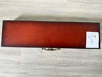 Closed cherry wood case top view