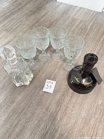 Group shot: Utopias bottle, crystal decanter with stopper, four Libbey Hobstar goblets