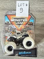 Front view of sealed Monster Jam Megalodon 1:64 die-cast truck in package