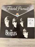 Front of game box with Beatles portraits and title