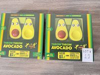 Front view of two sealed Throw Throw Avocado game boxes