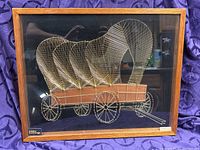 Full view of framed string art covered wagon