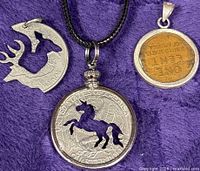 Front view of all three coin pendants