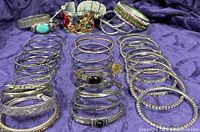 Overhead view showing full assortment of bracelets arranged in rows