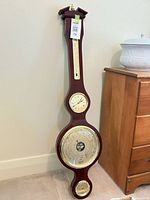 Full view of banjo barometer showing entire wood case and all dials