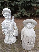 Front view of both resin statues