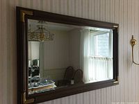 Front view of the rectangular beveled mirror on wall