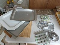 overview of assorted trays, platters, bowls, cutting board