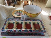 All items stacked: divided platter, flat platter, two salad plates, large bowl