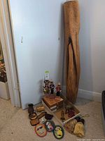 Full lot overview showing sculpture, dolls, Corona boxes and smaller decorative items