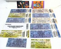 All 14 tickets laid out on white background