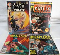 Group shot of all four comic issues standing upright