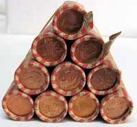 Pyramid stack of 10 paper-wrapped penny rolls with ends showing coin faces
