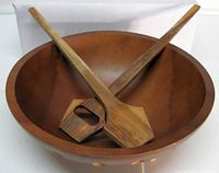 Bowl with tongs crossed inside showing size and design
