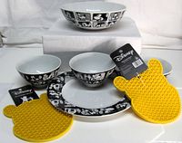 Full set: large bowl, three small bowls, plate, two yellow Pooh trivets