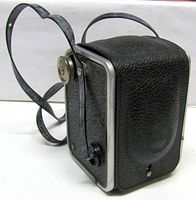 Side view of Kodak Duaflex showing leatherette covering, strap, and back door