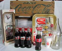 Full lot showing crate, clock, tray, bottles, cups and empty bottle