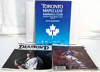 Front covers of all three magazines/programs displayed upright