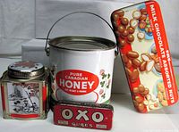 Group shot of all four tins showing relative sizes and designs