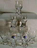 Front view of ten Bohemia crystal shot glasses stacked