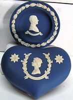 Heart box and round dish front view showing relief portraits
