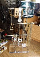 Full view of acrylic stand holding jewelry
