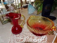 Pitcher and bowl side by side on table