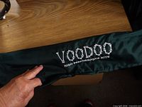 Green sleeve showing VOODOO High Performance Kite embroidery