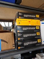 Stack of Kodak Carousel Transvue 140 slide tray boxes on shelf