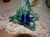 Freeform teal and cobalt Murano stretch basket with foil label visible