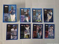 Stack and spread of blue parallel cards, front images visible