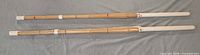 Full view of both bamboo shinai practice swords