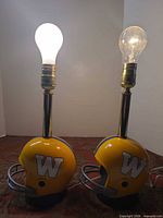 Front view of both helmet lamps lit and unlit