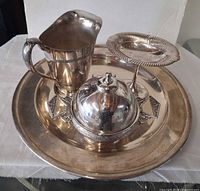 Group shot of all five silver plated serveware pieces