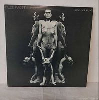 Front cover showing album artwork and titles