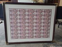 Front view of framed proof sheet showing full arrangement of banknotes