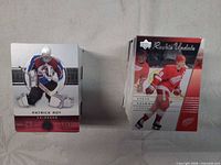 Stacks of two piles of hockey trading cards showing front card Patrick Roy and Steve Yzerman Rookie Update