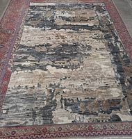 Full view of entire rug showing abstract pattern and size