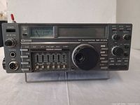 Front view showing control panel, knobs, display and stand