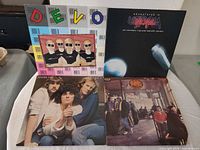 Group shot of all four album jackets