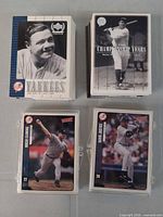 Two large stacks of Yankees Legends and Championship Years cards; two Victory cards in top-loaders visible