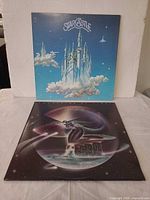Front covers of both Starcastle LPs