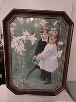 Full view of framed print showing children and lilies in octagonal frame