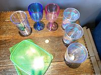 Overview of all drinkware and lids on table