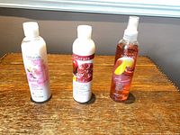 All three Avon Naturals bottles front view