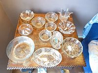 Top view of all eleven clear glass pieces on table